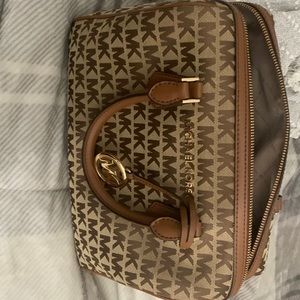 Brown and tan Michael Kors bag with adjustable strap